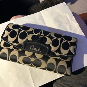 Black and white Coach wallet.